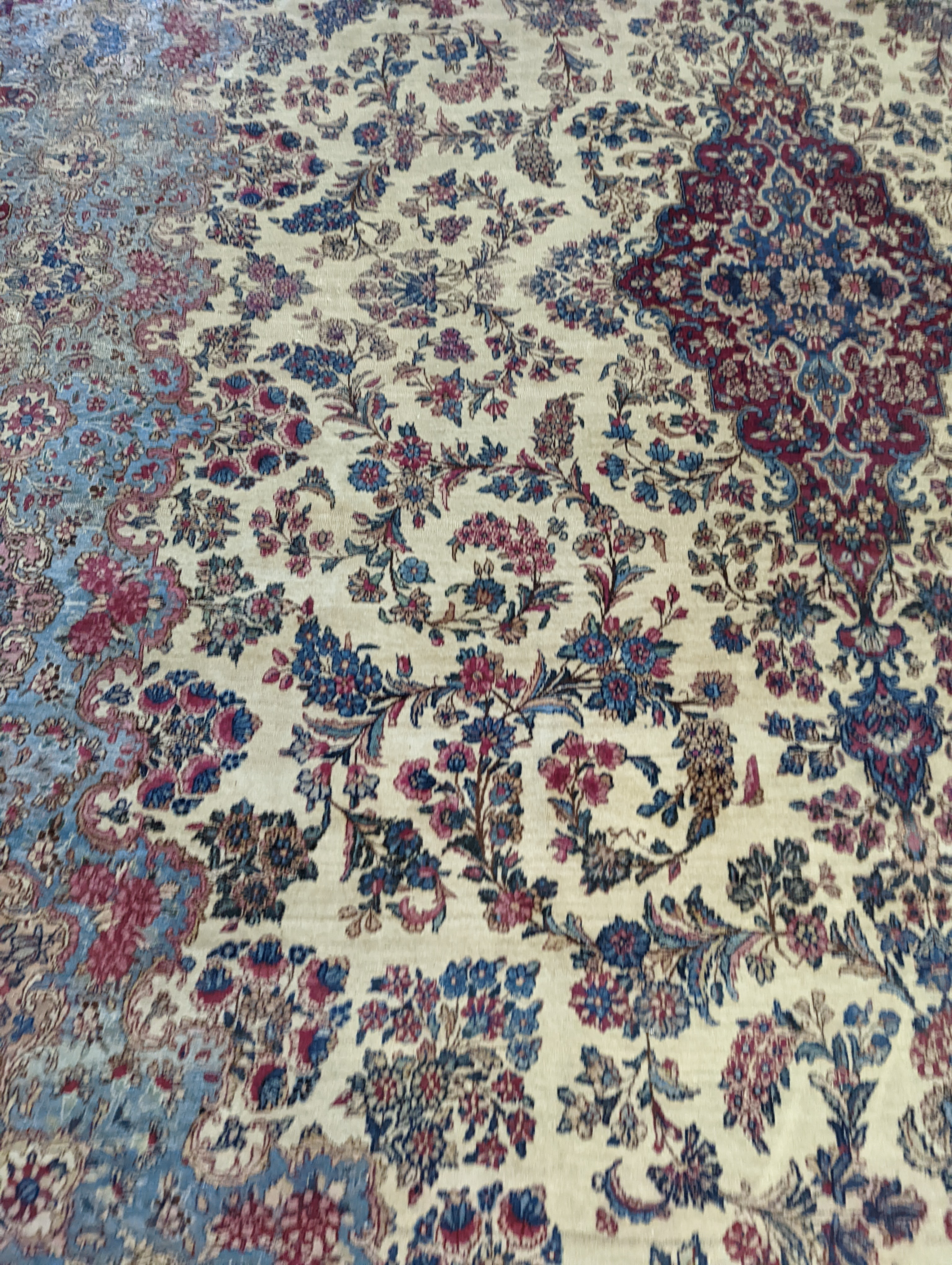 A North West Persian ivory ground carpet, 396 x 290cm